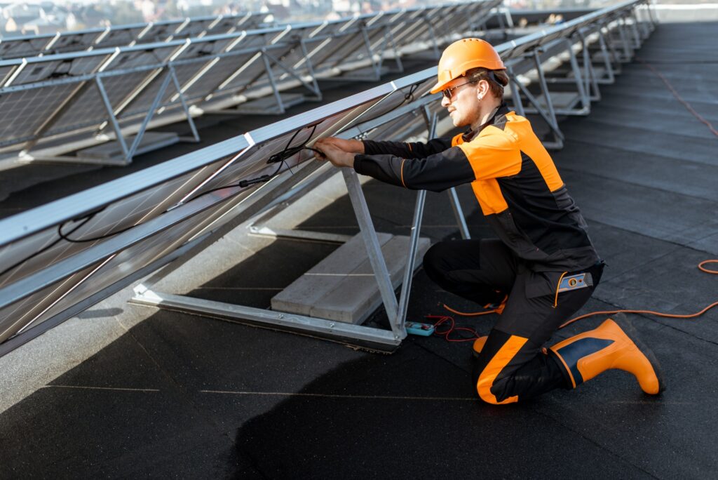 Electrician connecting solar panels